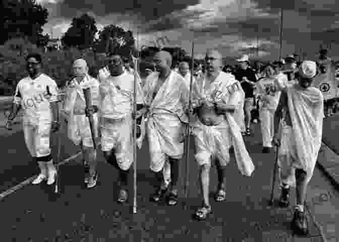 Mahatma Gandhi, A Thin, Elderly Man With A White Beard, Leading A Protest March. Devotion: An Epic Story Of Heroism Friendship And Sacrifice